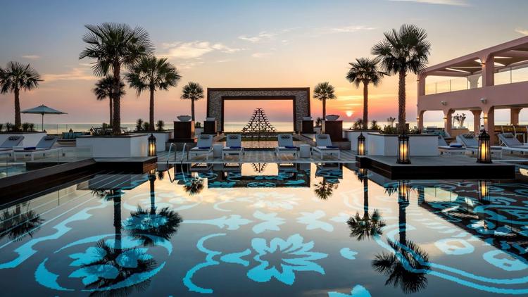 Luxury Beach Resort with Infinity Pool at Sunset